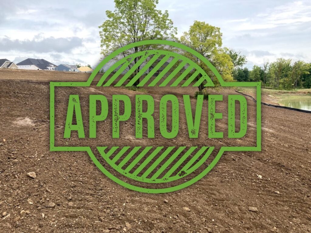 Green stamp with "APPROVED" marking.
